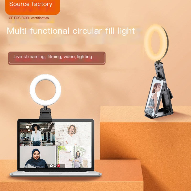 Multi-functional circular fill light with stand on an orange background