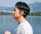 Lifestyle photo of a customer using Open-Ear Bone Conduction Headphones