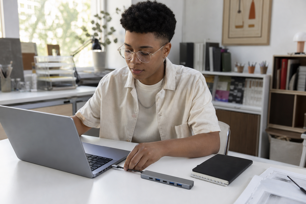 Lifestyle photo of a customer using 7-in-1 USB-C Hub for Laptops